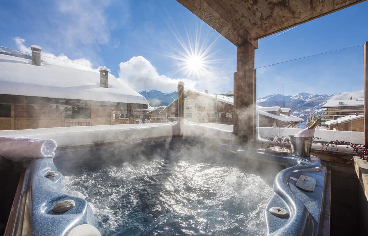 verbier mountain views from a hot tub