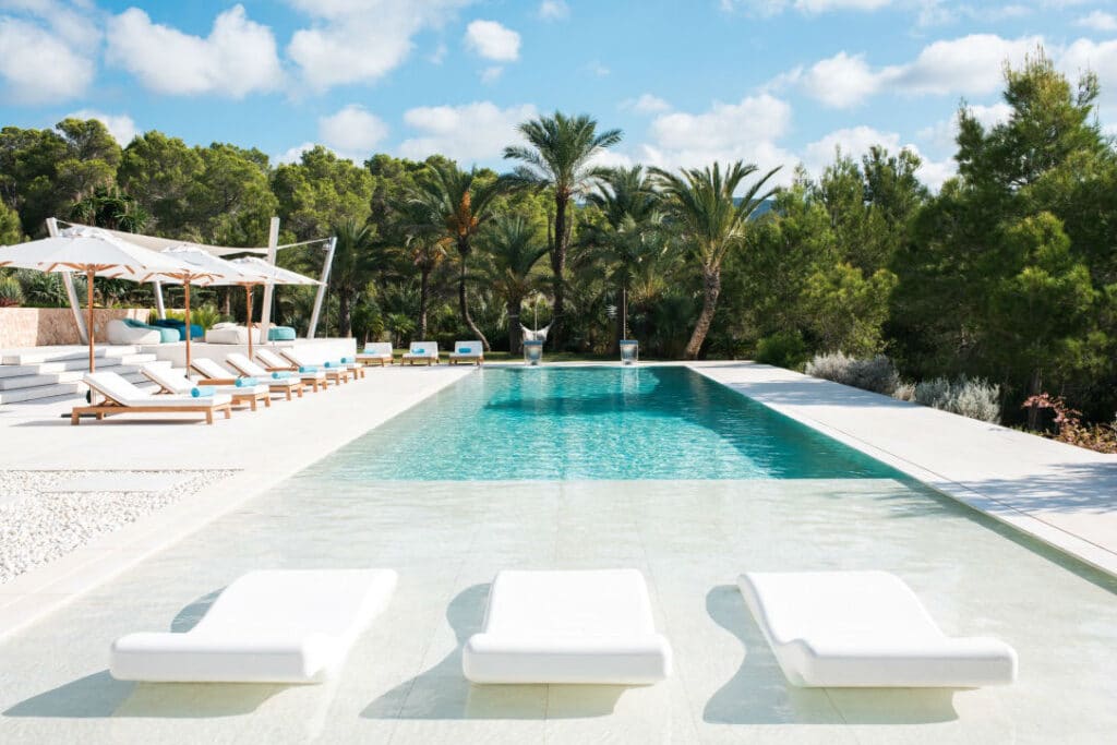 Villa Casa Acqua Ibiza Pool and loungers surrounded by trees - private villa