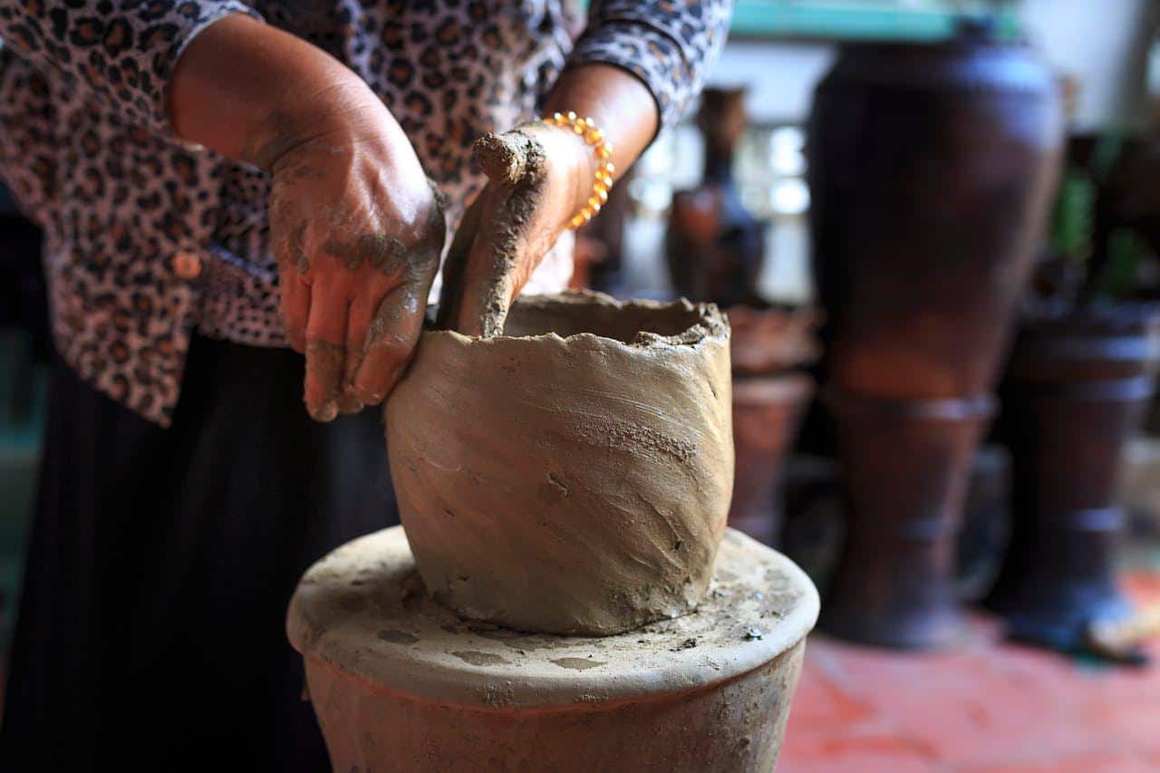 woman making pottery at pottery class